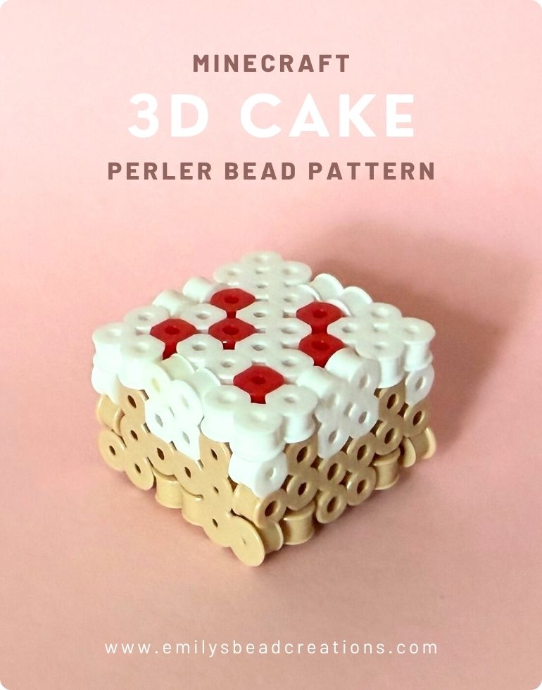 A photo of a 3D Minecraft cake made out of fuse beads on a pink background.