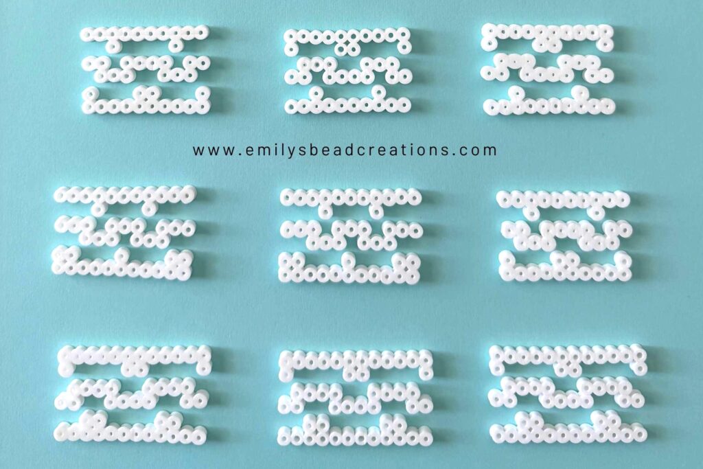 A photo of 9 sets of perler bead lines that clip together to form the ghast's tentacles.