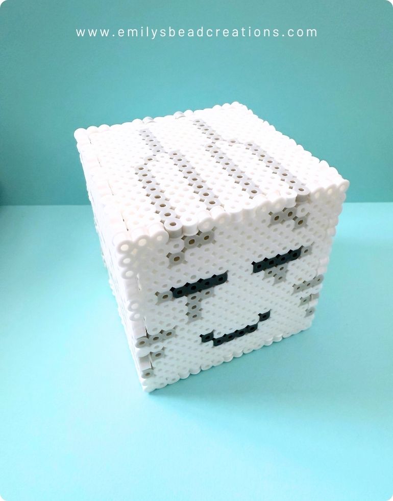 A photo of the 3D Minecraft Happy Ghast's assembled head, which is a 16x16x16 cube.